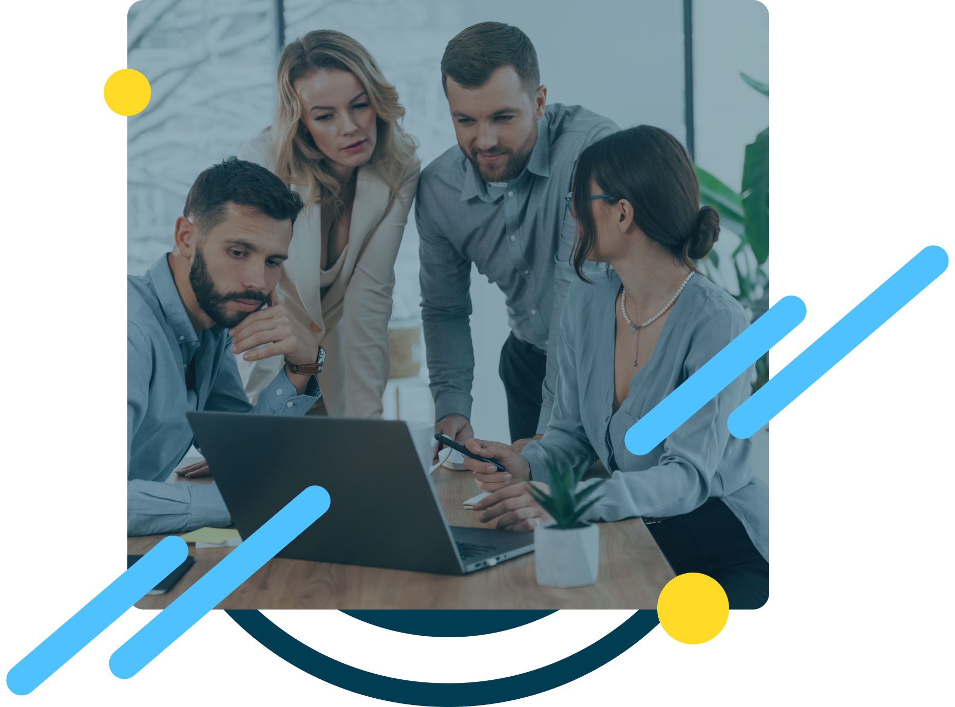 Picture of a group of people in font of a computer