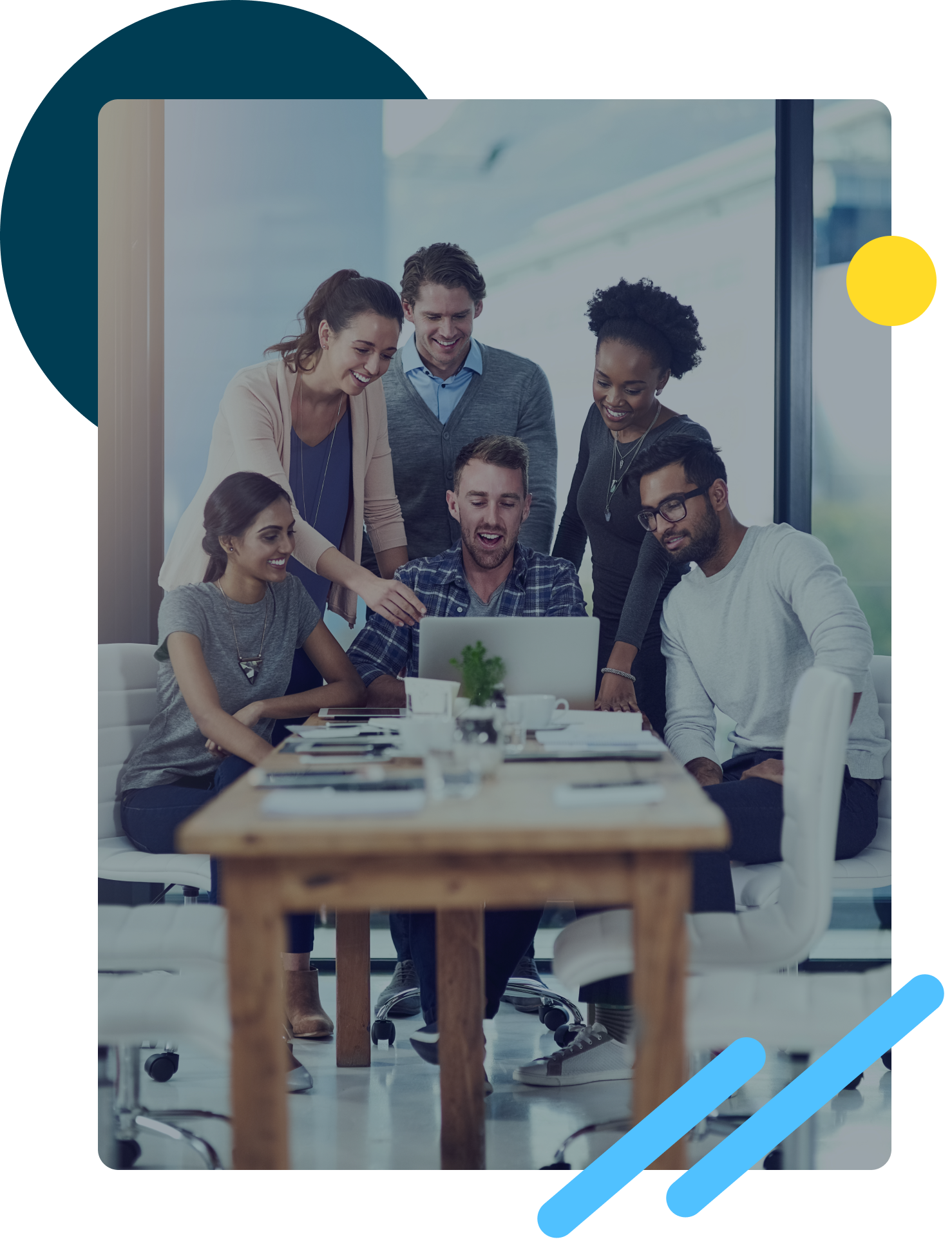 Group of people working together in front of a computer
